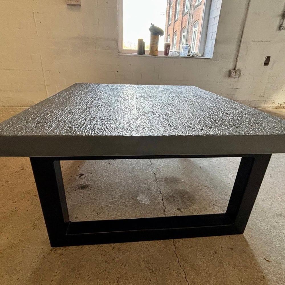 Grey Textured Concrete Coffee Table With Square Black Metal Legs